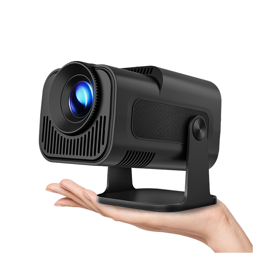 Black portable projector held in a hand against a white background